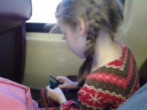 K crocheting on the train 