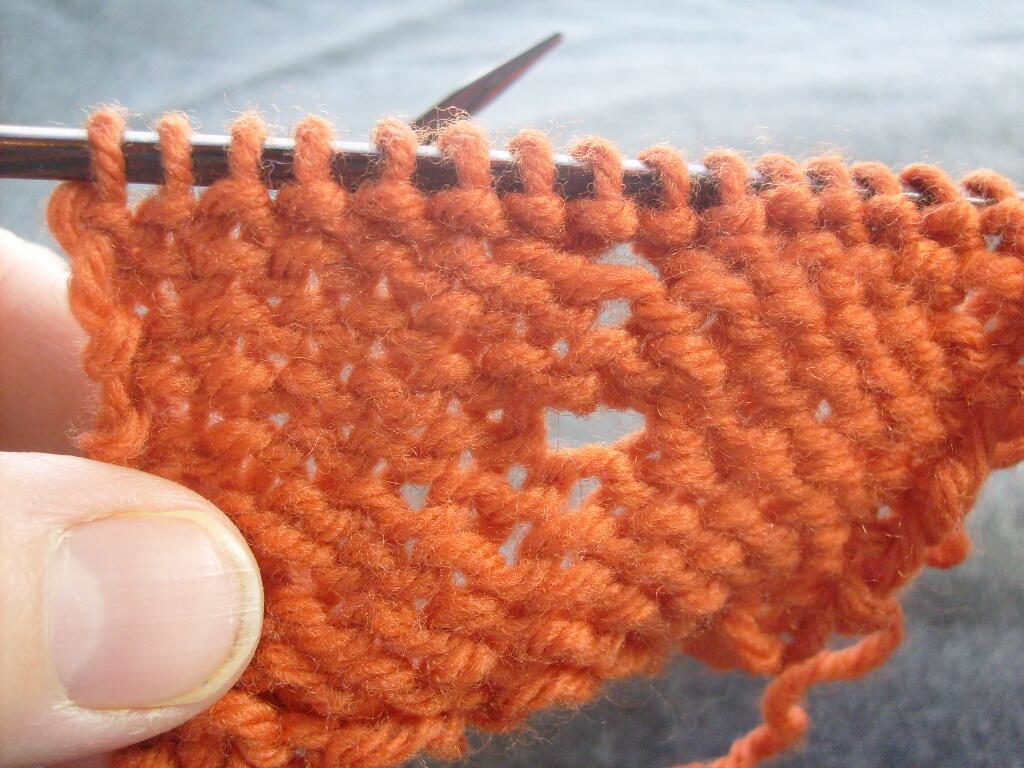 p1, k1, p1 in one stitch, with a row above it