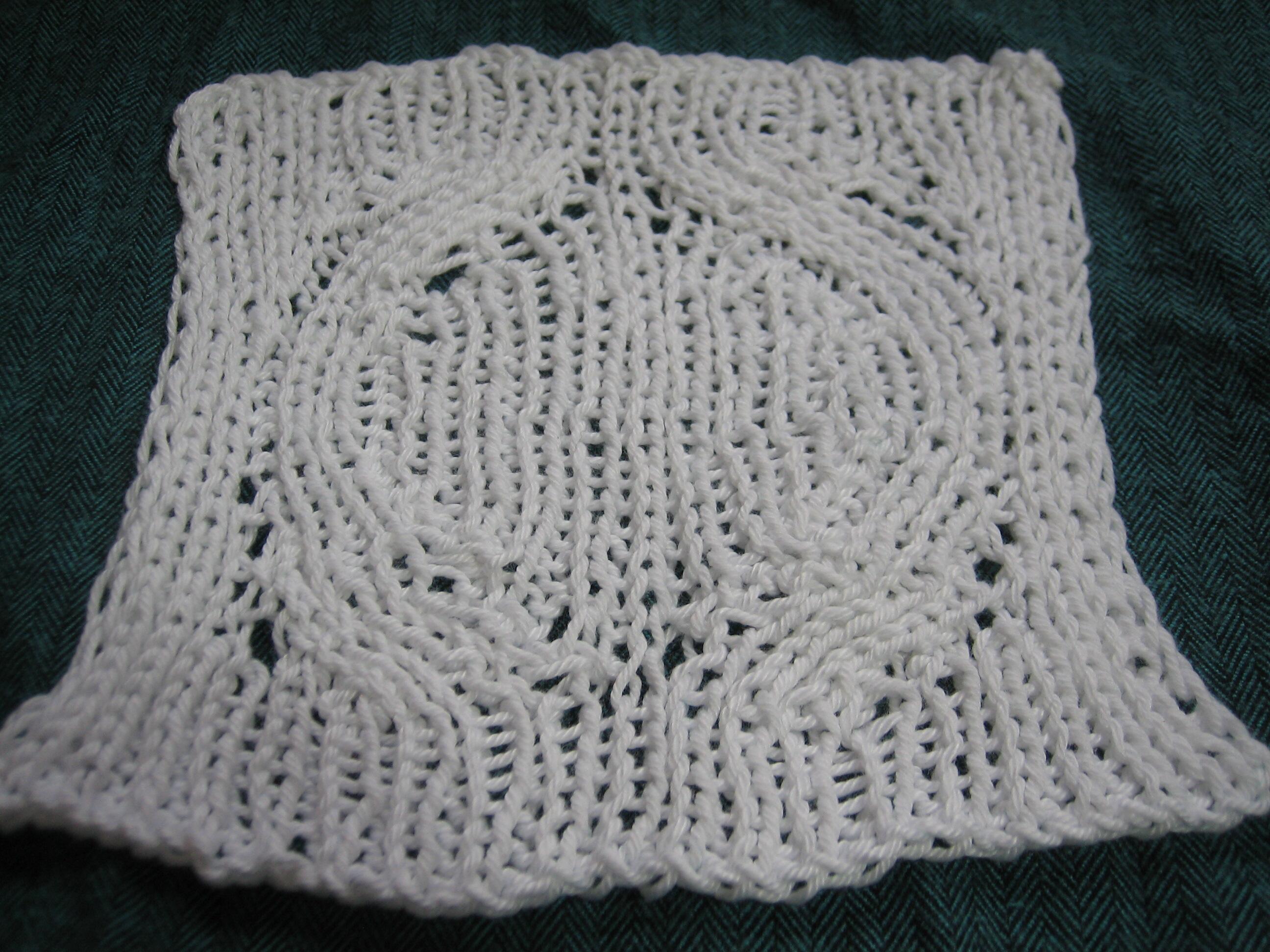 Short Row Slides in ribbing in cotton yarn. The swatch lay mostly flat even before blocking. I lost the belly band of the cotton I used, but I'm sure it was not organic, and I'm pretty sure it was Mercerized.