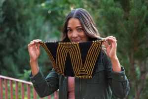 Woman models WW cowl in Knitting