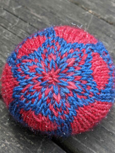 Stranded colorwork juggling ball from Pegasus Constellation pattern