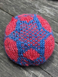 Stranded colorwork ball from Pegasus Constellation pattern, side star showing