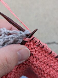 knitting off the swatch page with the cover