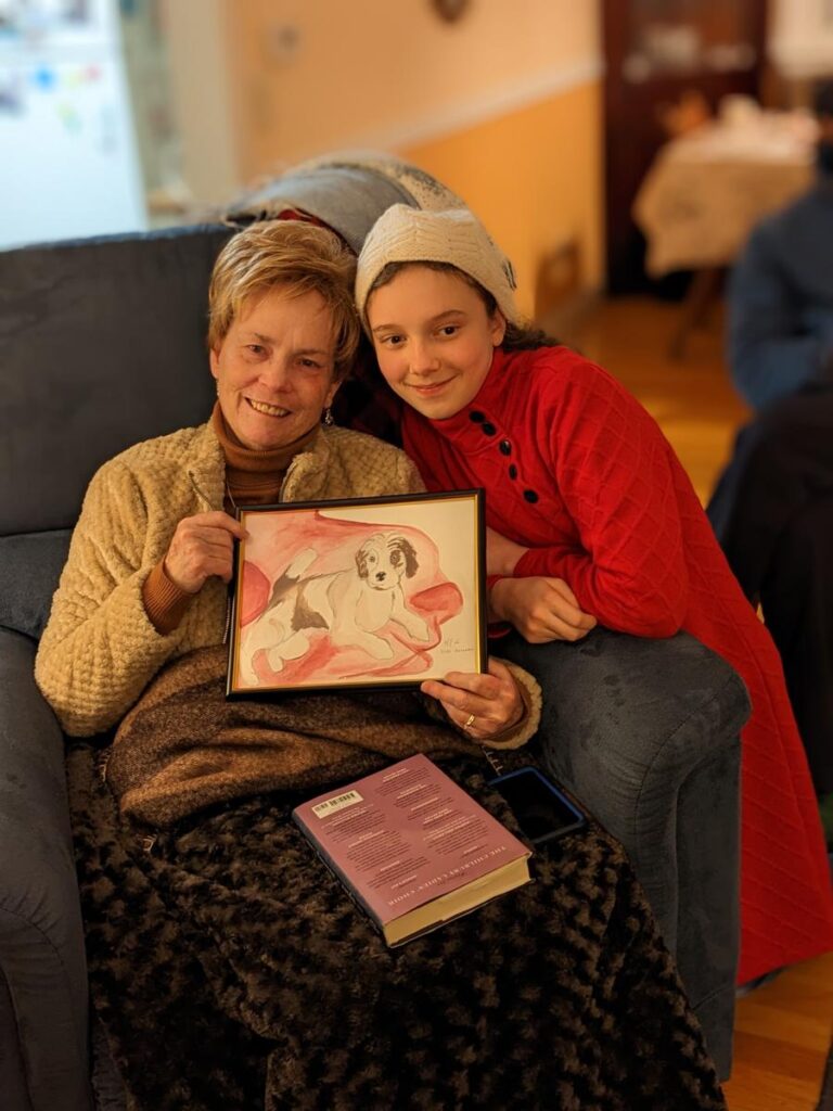 Aunt Susan and Kari with the portrait of Susan's Puppy that Kari painted