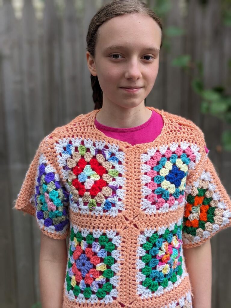 Front View of altered Granny Square Sweater with short row shoulder shaping