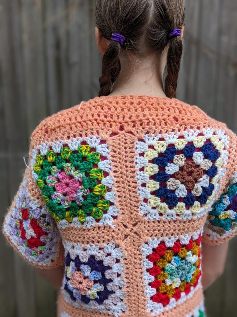 Back View of altered Granny Square Sweater with short row shoulder shaping