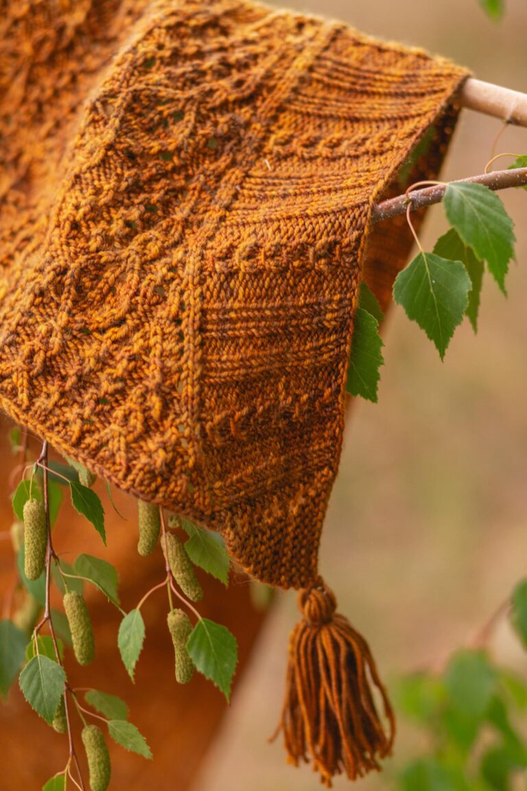 Tassel of Hollywood and Vine Shawl draped over a birch branch Photo by Elizabeth Zimmerman of Western Rose Studios.