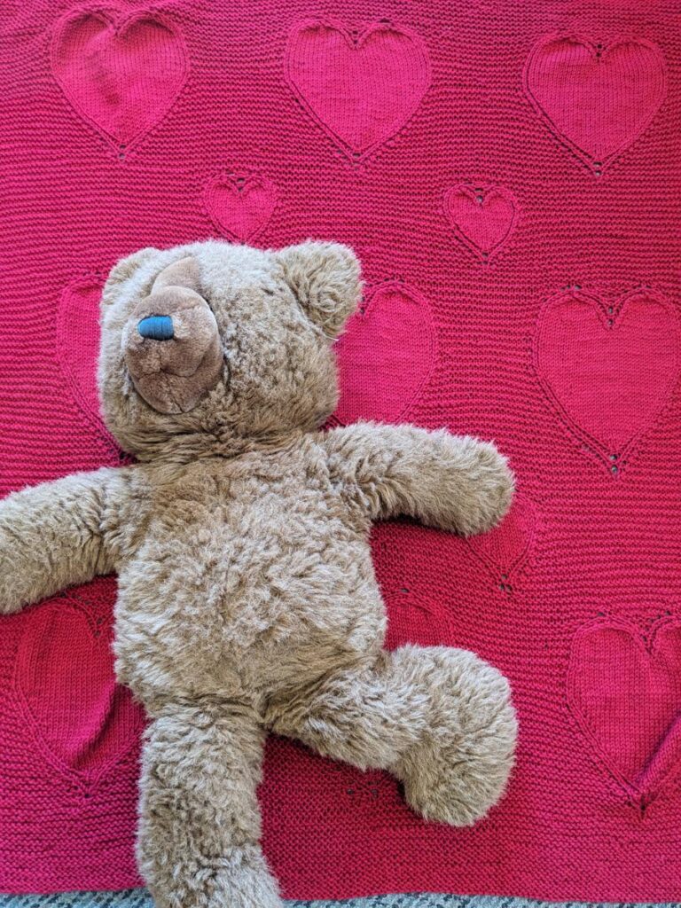 the Glad Heart blanket with large teddy bear